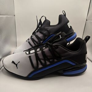 Puma Axelion Fade running shoes in a black, grey, and blue colorway. Mens 11 1/2